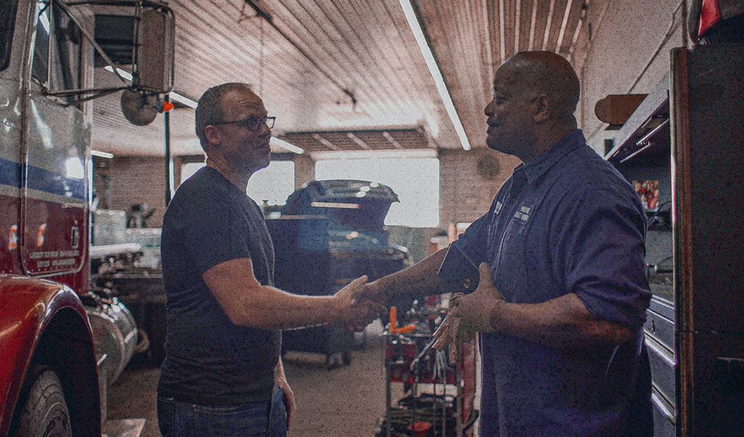 image of a fleet manager shaking hands